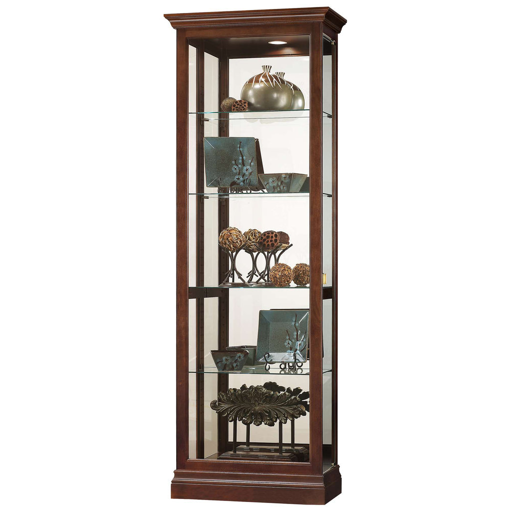 A tall wooden display cabinet with glass shelves showcasing decorative items.