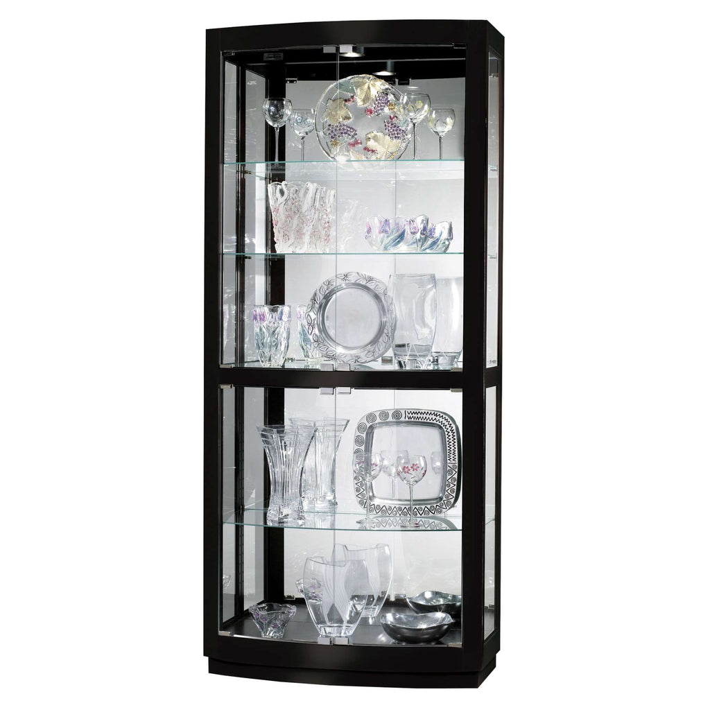 A black glass display cabinet showcasing various decorative glassware and crystal items.