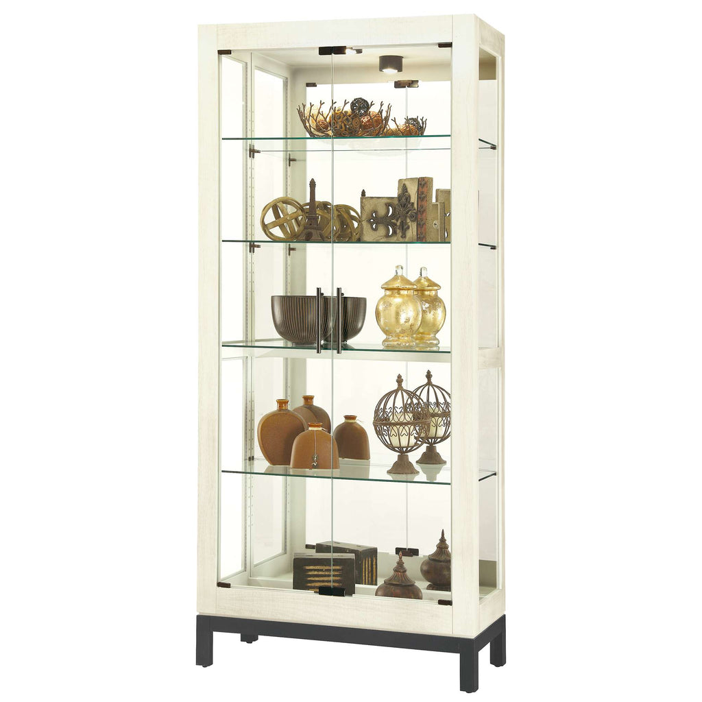 Display cabinet featuring various decorative items and collectibles
