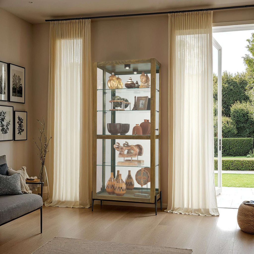 Stylish display cabinet showcasing decorative items in a well-lit living room.