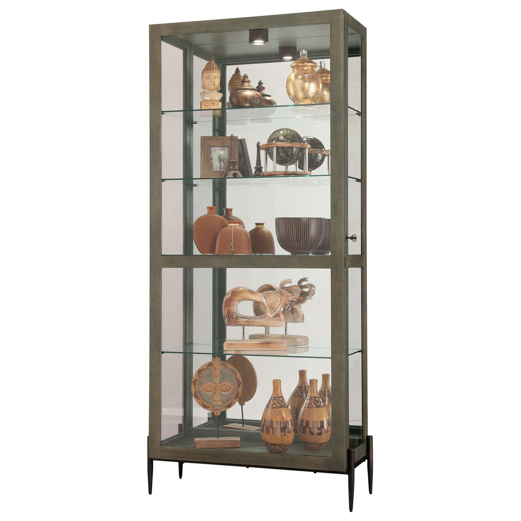 A contemporary glass display cabinet showcasing various decorative items and pottery.