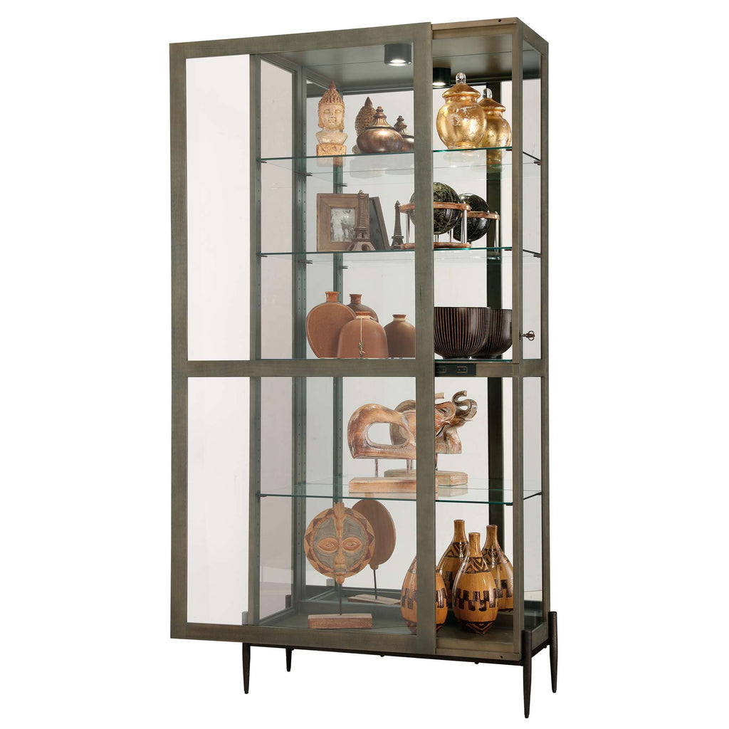 A modern display cabinet featuring glass shelves and an assortment of decorative items.