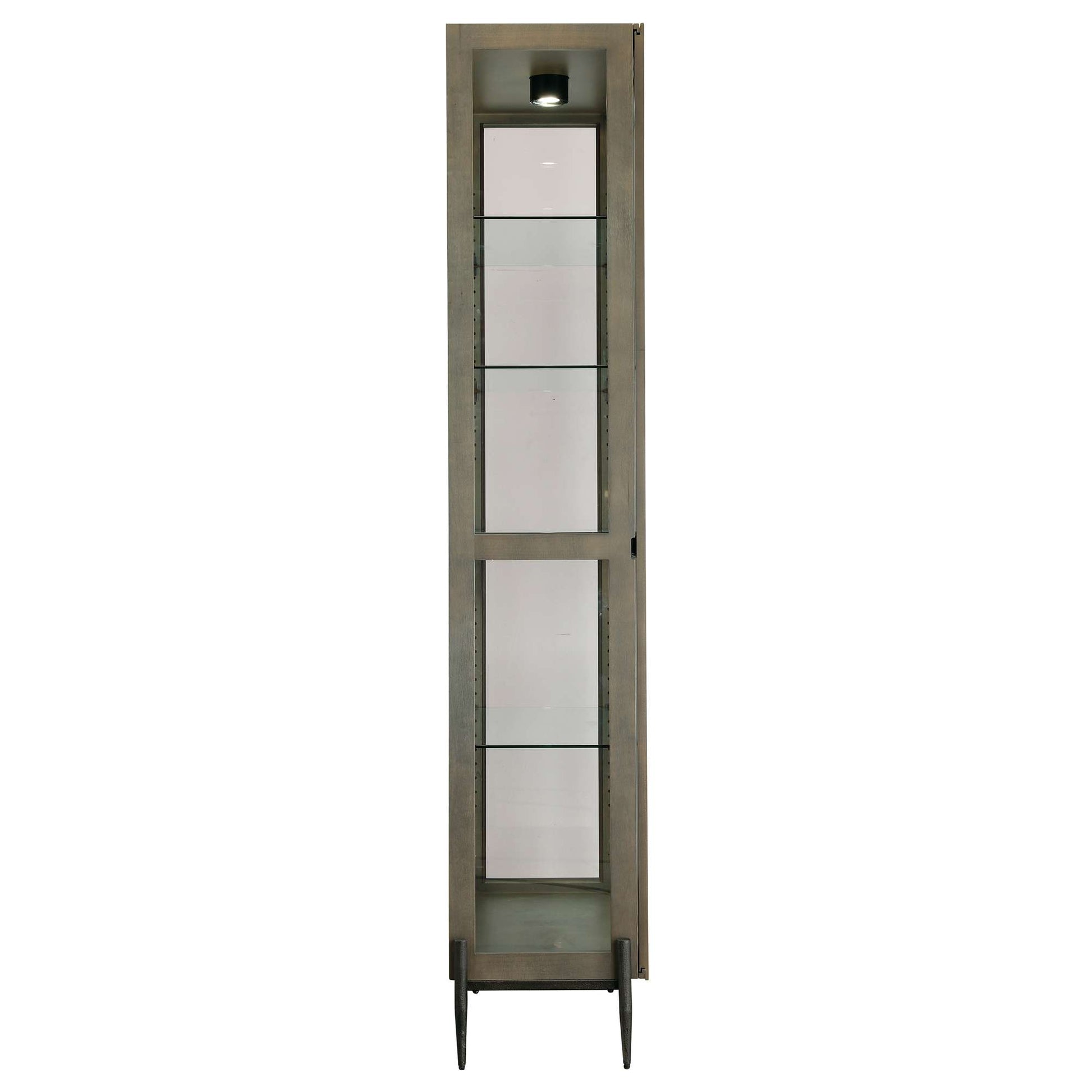 A tall, narrow display cabinet with glass shelves and a light on top.