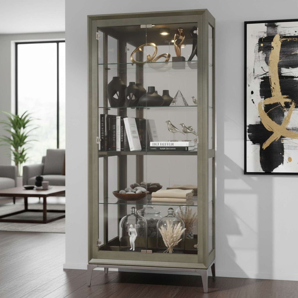 A modern glass display cabinet showcasing decorative items and books, placed in a stylish living room.