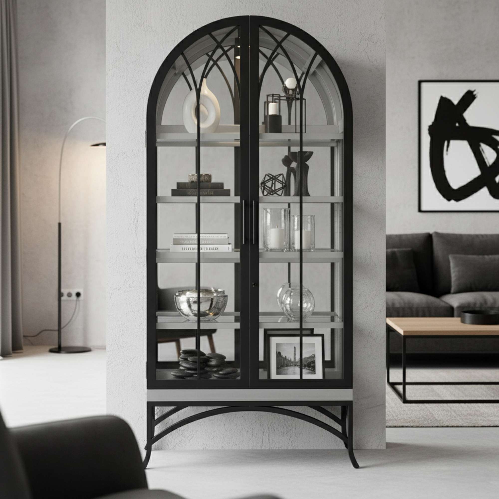 A modern black display cabinet with glass shelves and an arched design, set in a stylish living room.