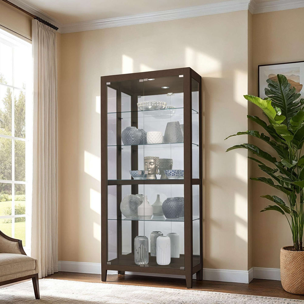 A modern glass display cabinet with several decorative vases and a large leafy plant in a well-lit room.
