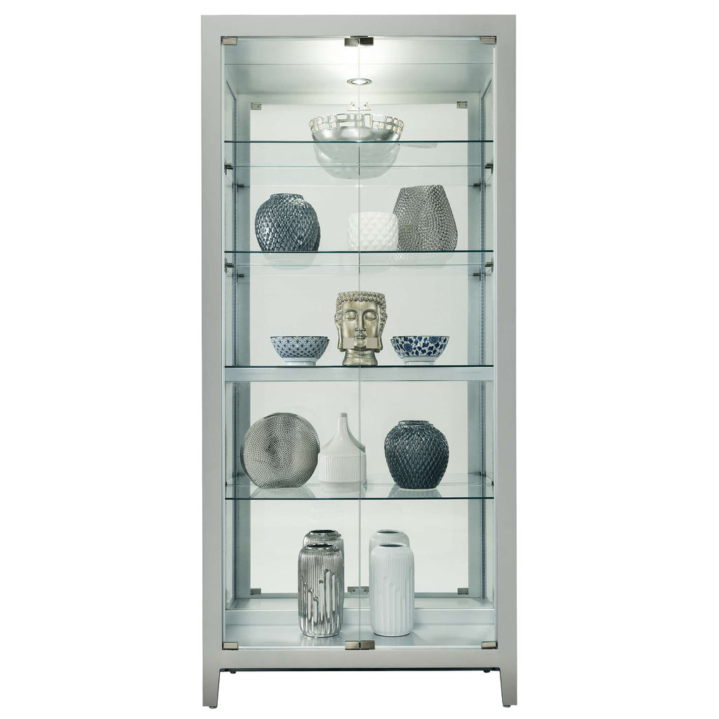 A glass display cabinet showcasing various decorative vases and sculptures.