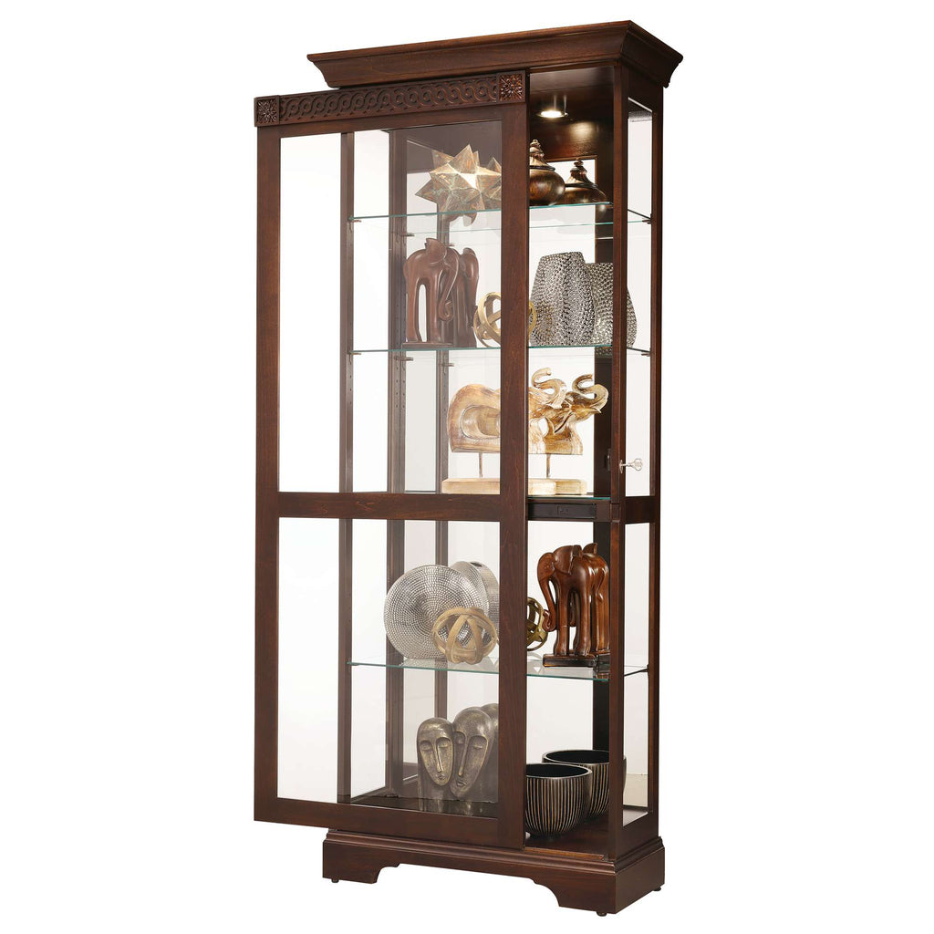 Tall wooden display cabinet showcasing various decorative items