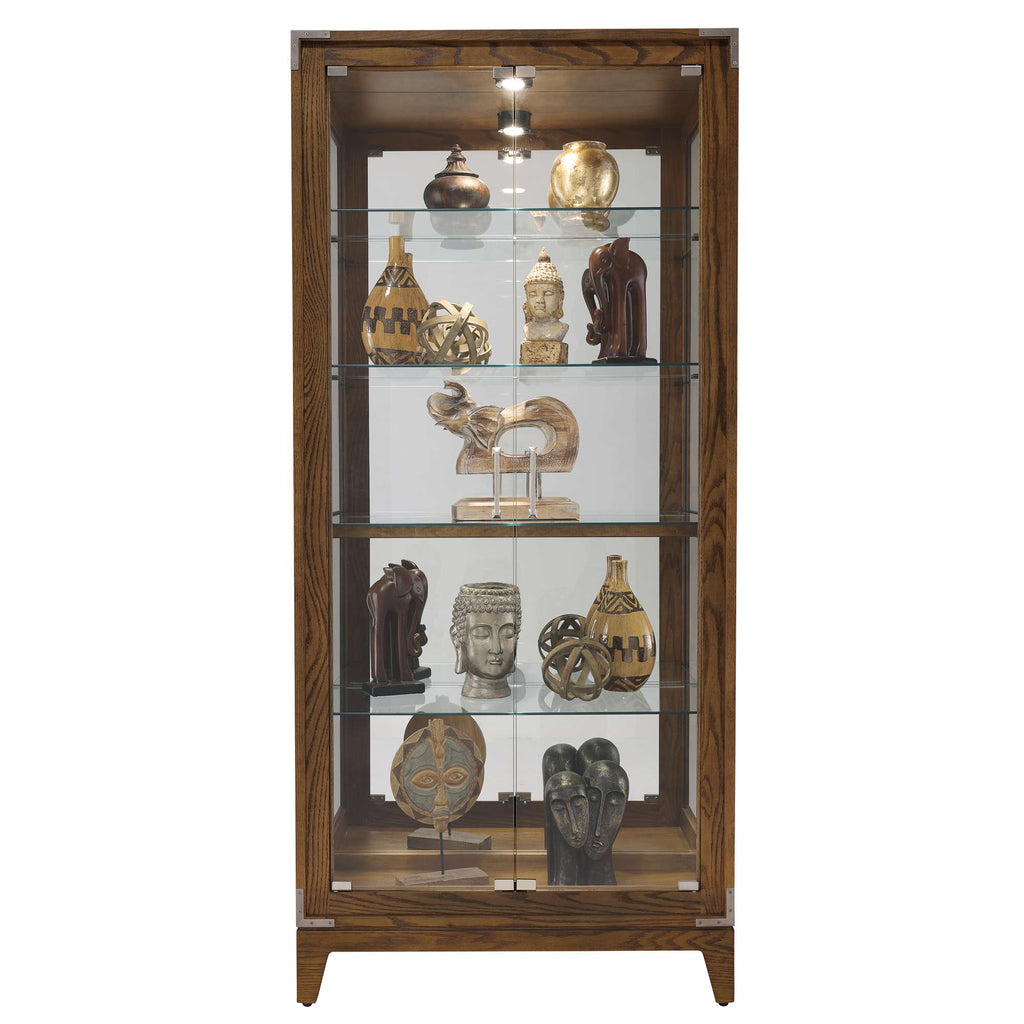 A tall display cabinet showcasing various decorative sculptures and artifacts.