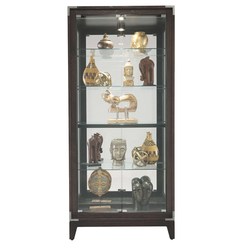 A display cabinet showcasing various decorative artifacts and sculptures.