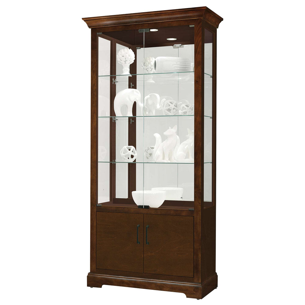 Wooden display cabinet with glass shelves and decorative white figurines