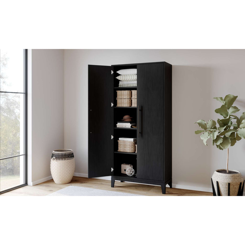A modern black cabinet with open shelves, displaying neatly arranged items, in a well-lit room.