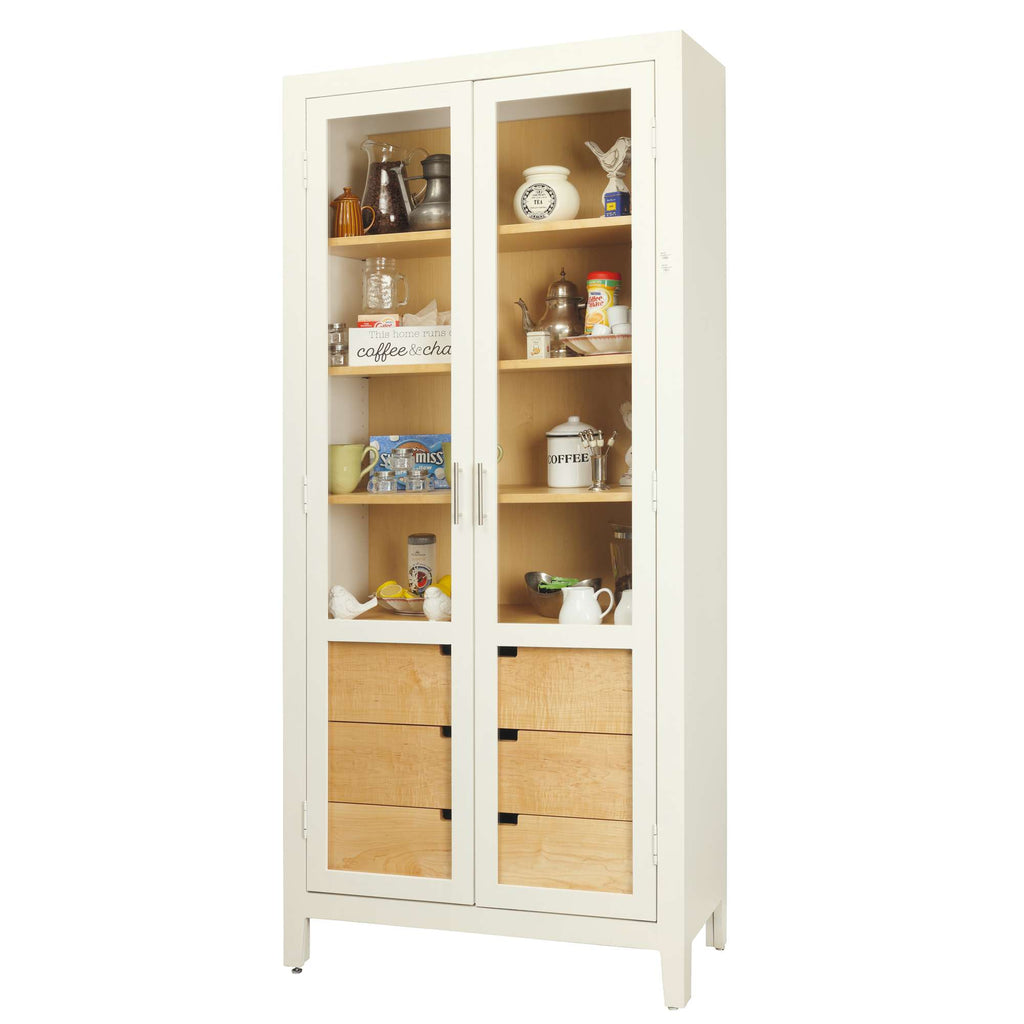 A tall, white cabinetry display with glass doors showcasing various kitchen items.