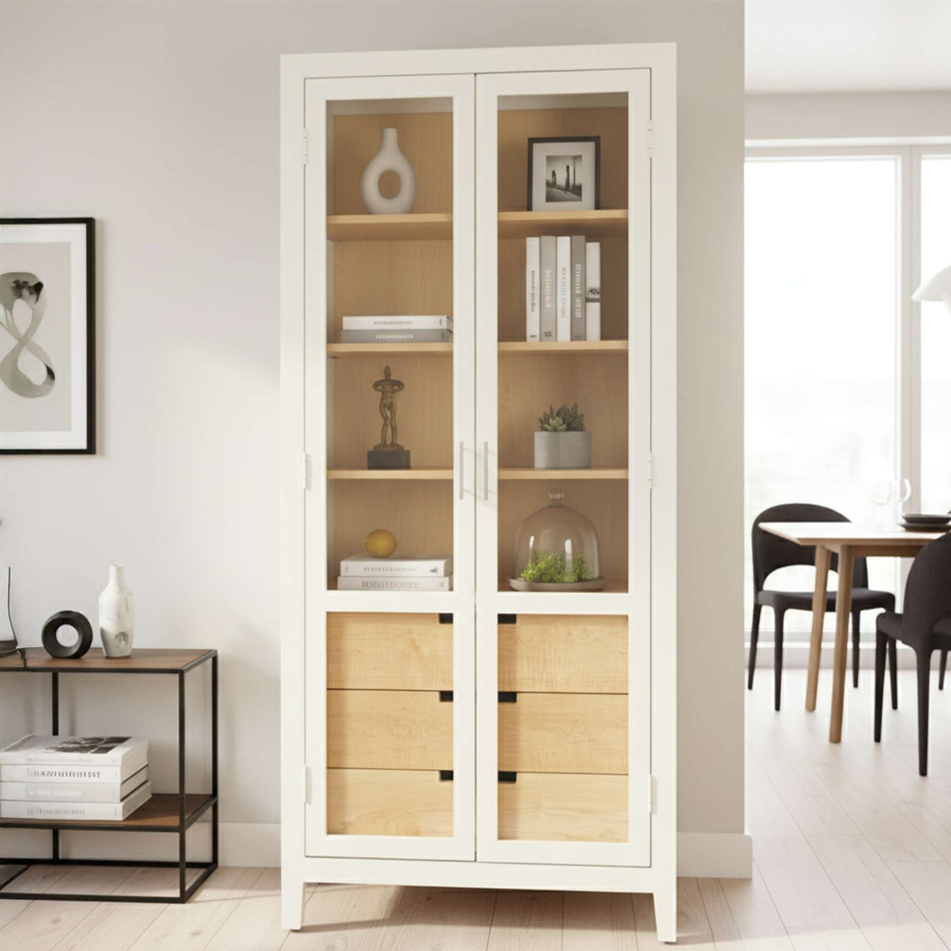 Modern white cabinet with glass doors and wooden drawers, placed in a bright room.