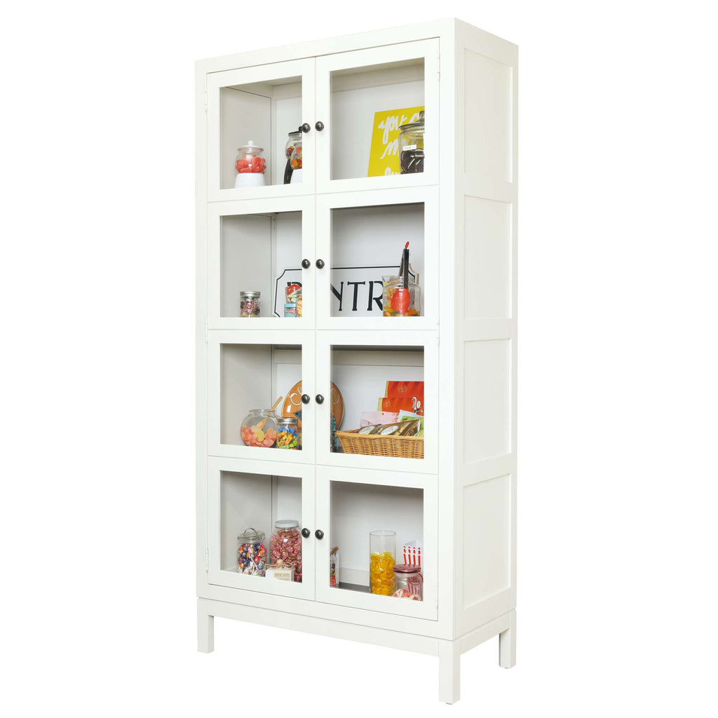 White display cabinet with glass doors, featuring various colorful items inside.