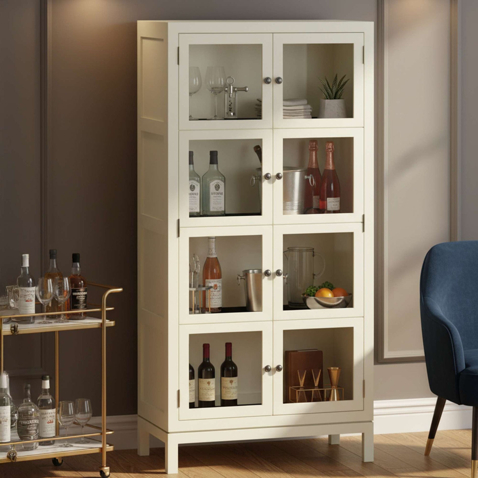 A stylish white cabinet with glass doors displaying various bottles and decor items.