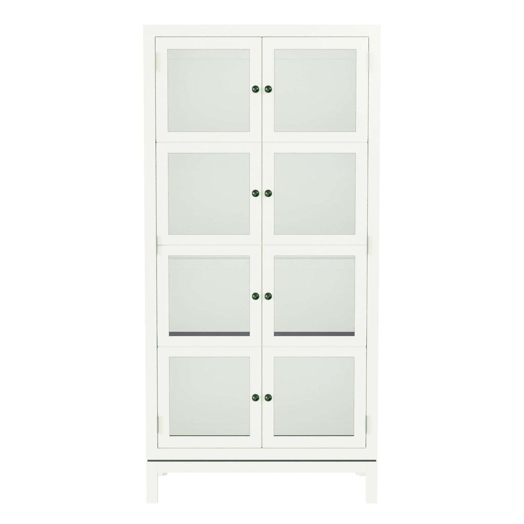 A tall white cabinet with glass doors and green knobs.
