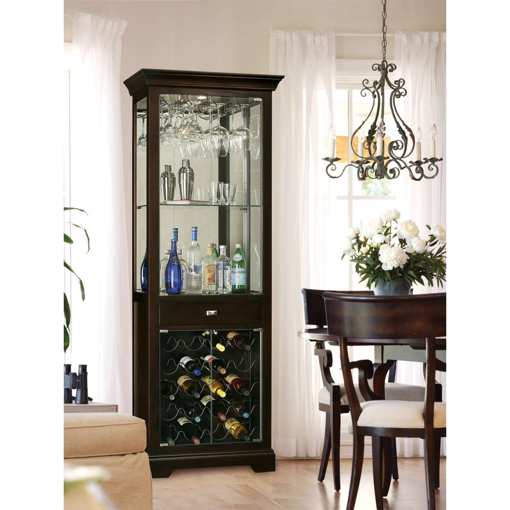 Elegant glass-front cabinet displaying drinks and wine bottles in a dining room setting.