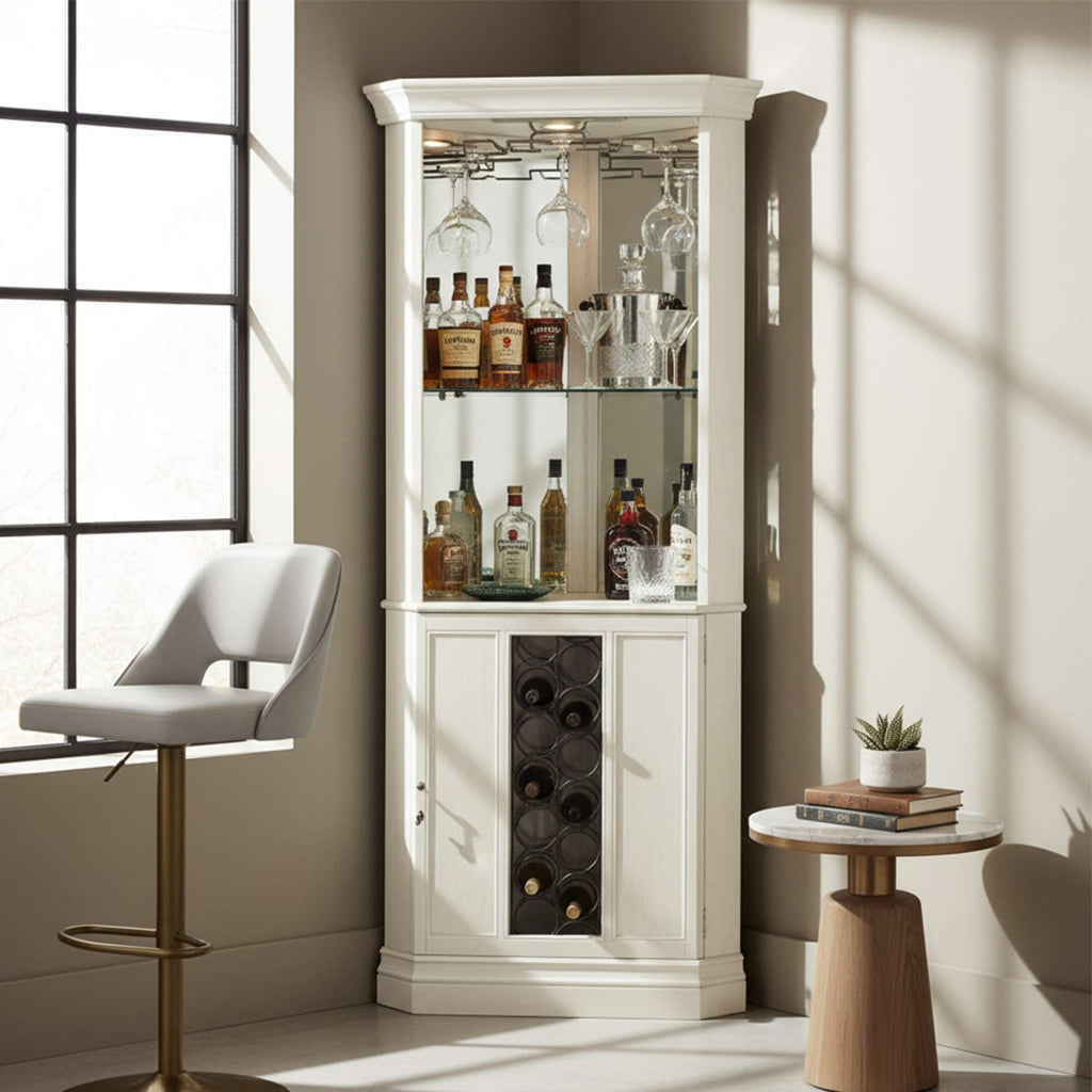 Elegant corner bar cabinet displaying various bottles and glassware, with a modern chair and side table in a well-lit room.