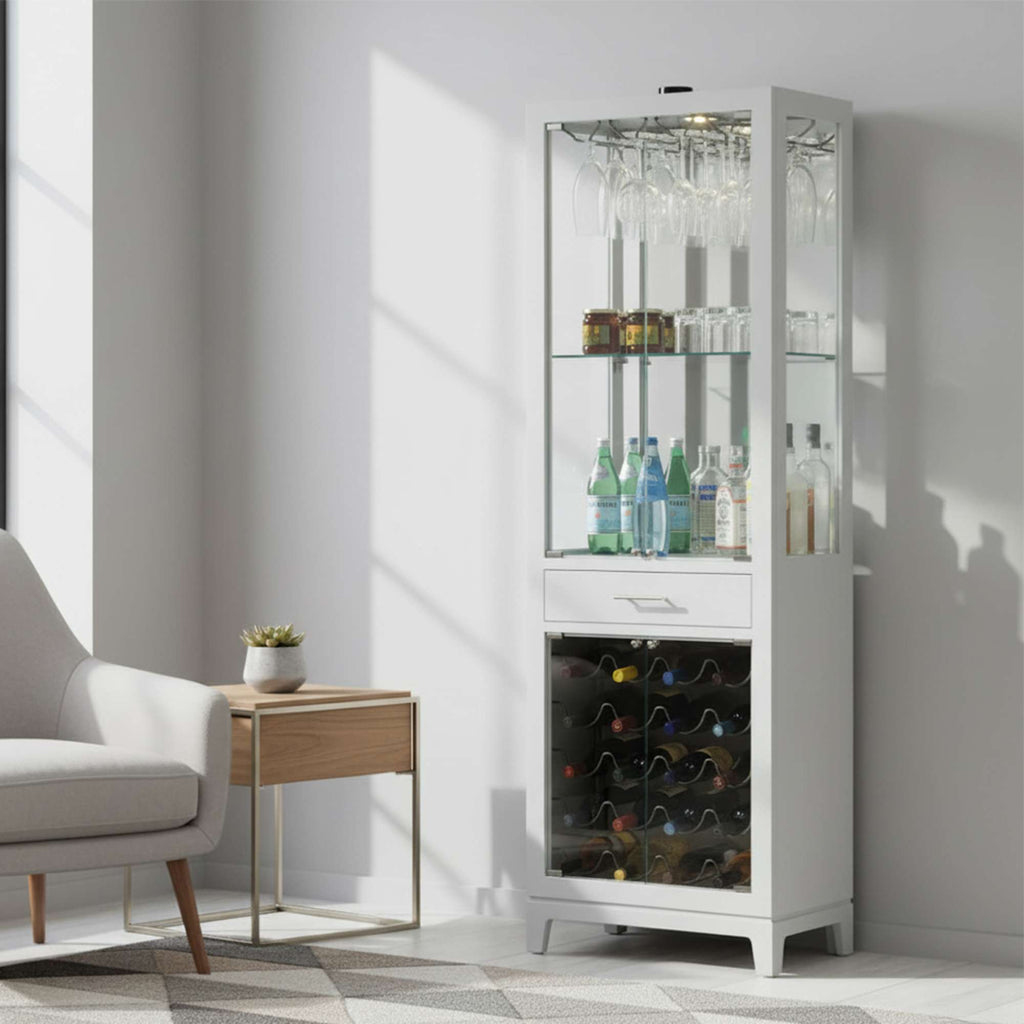 A modern glass display cabinet featuring drinks, glasses, and a wine cooler, placed in a bright room with a chair and side table.