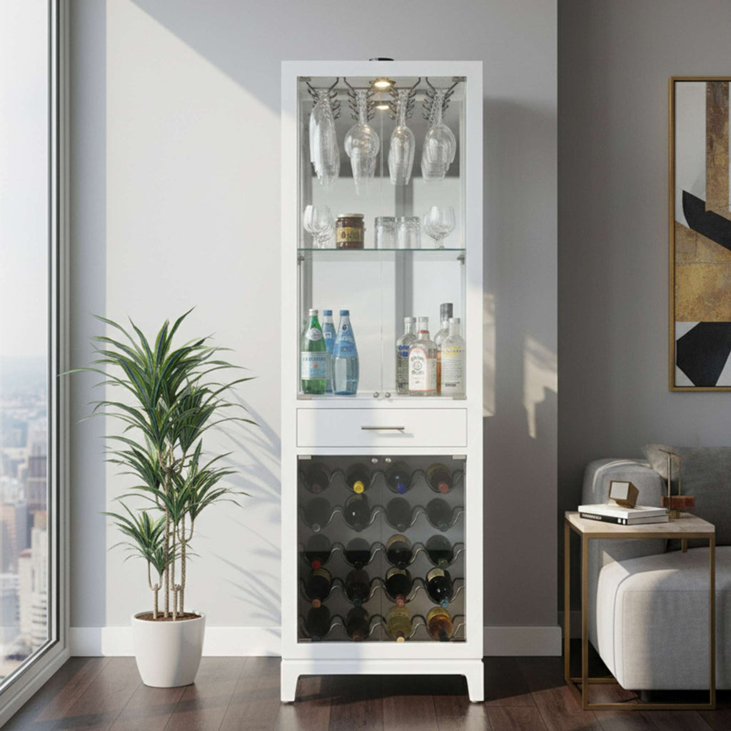 A contemporary white cabinet displaying glassware, beverages, and wine, with a plant beside it in a well-lit room.