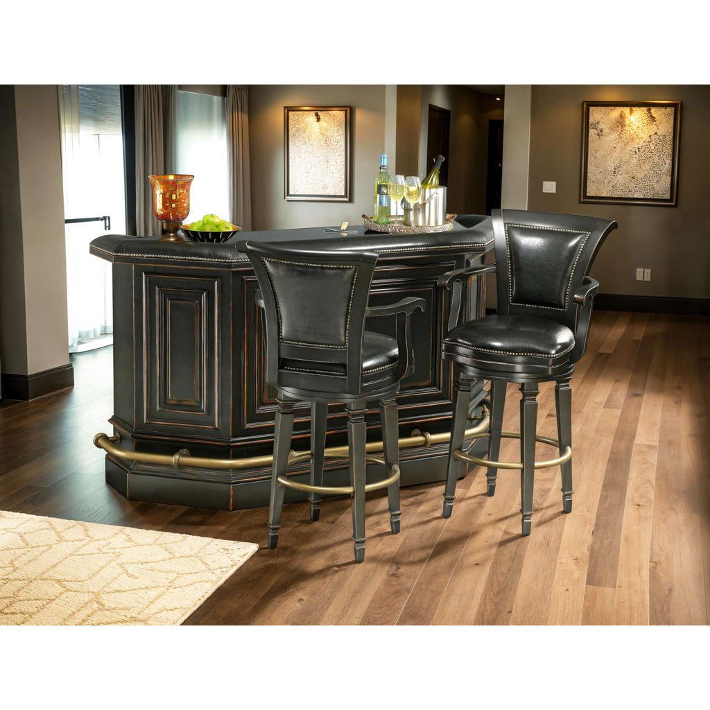 Home bar area with two black leather stools and a wooden counter