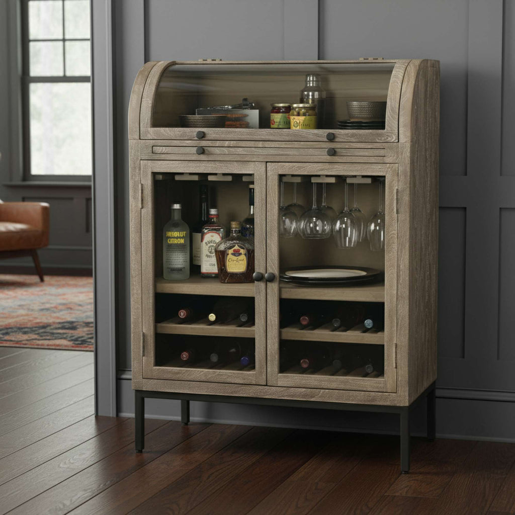 Wooden bar cabinet with glass doors displaying bottles and glasses