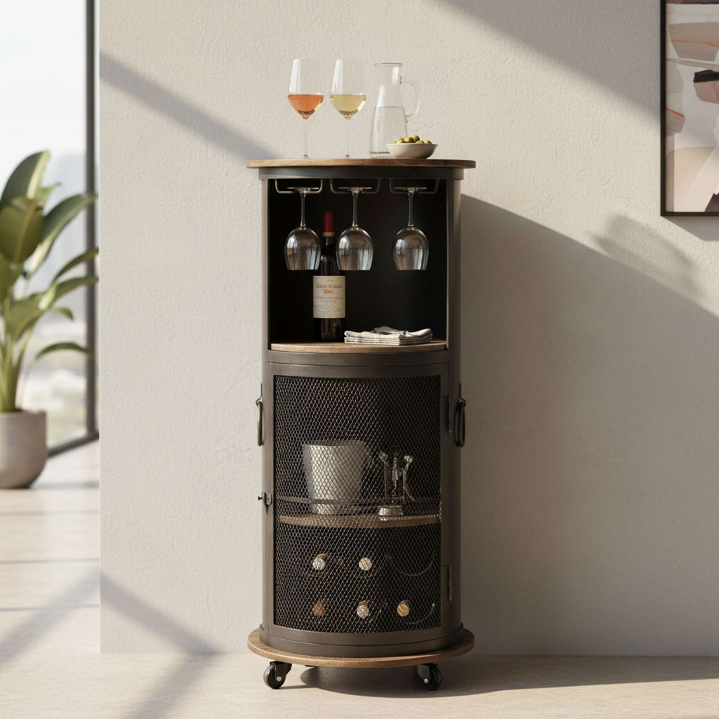 A stylish bar cart featuring wine glasses, a bottle of wine, and storage for drinks, set against a bright room with a plant.
