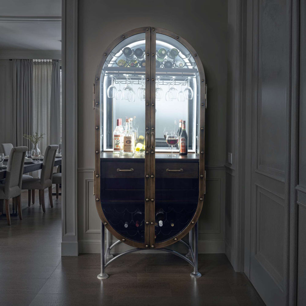 Elegant bar cabinet with illuminated shelves displaying various bottles.