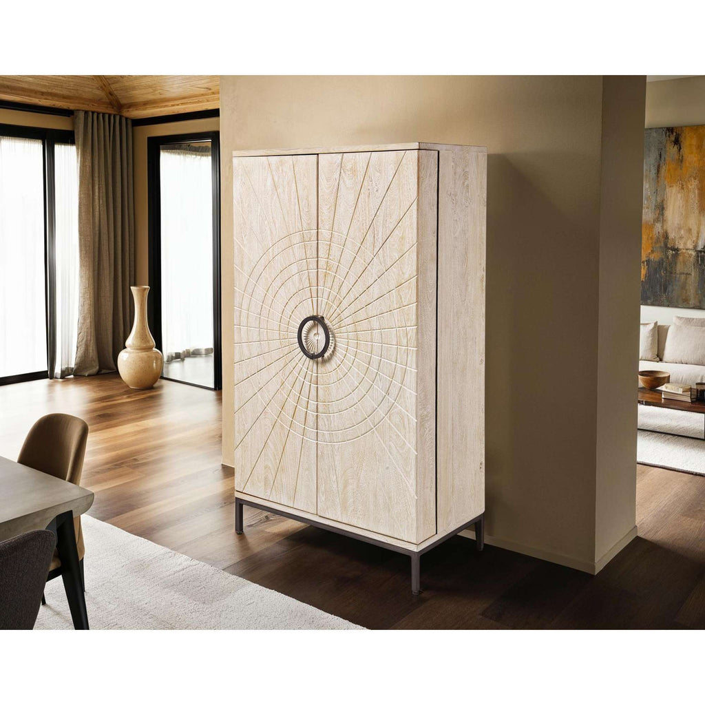 Elegant cream-colored wardrobe with a decorative sunburst pattern, positioned in a contemporary living space.