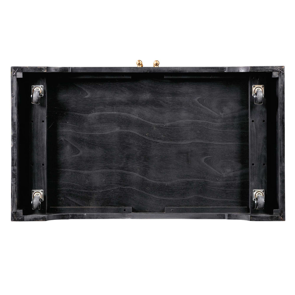 Interior view of a black wooden case with metal wheels.