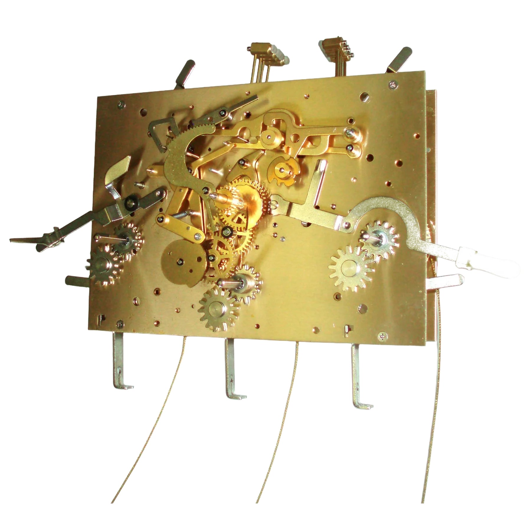 Gold mechanical clock movement with gears and levers for DIY clock projects.