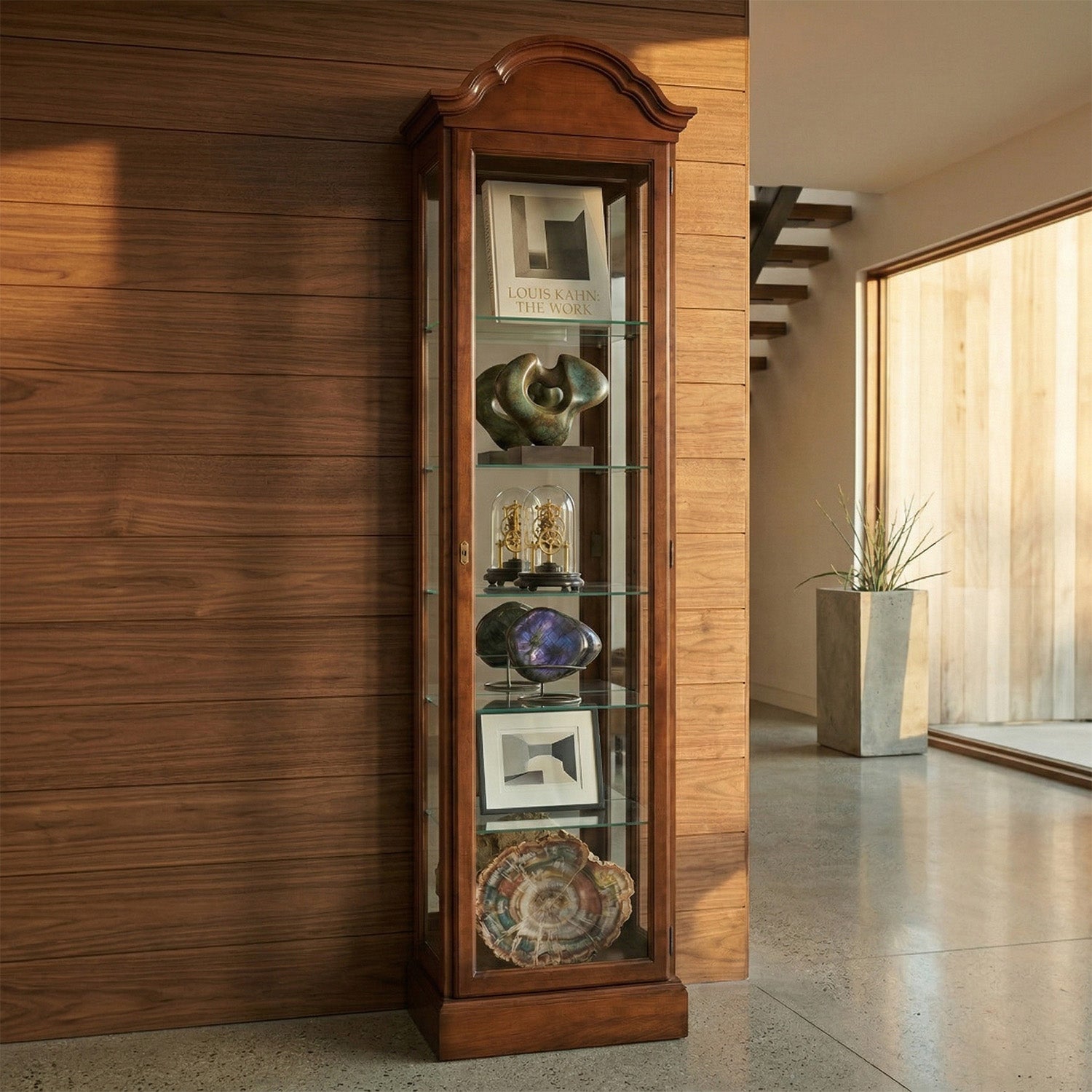 Wooden display cabinet with decorative items against a wooden wall.