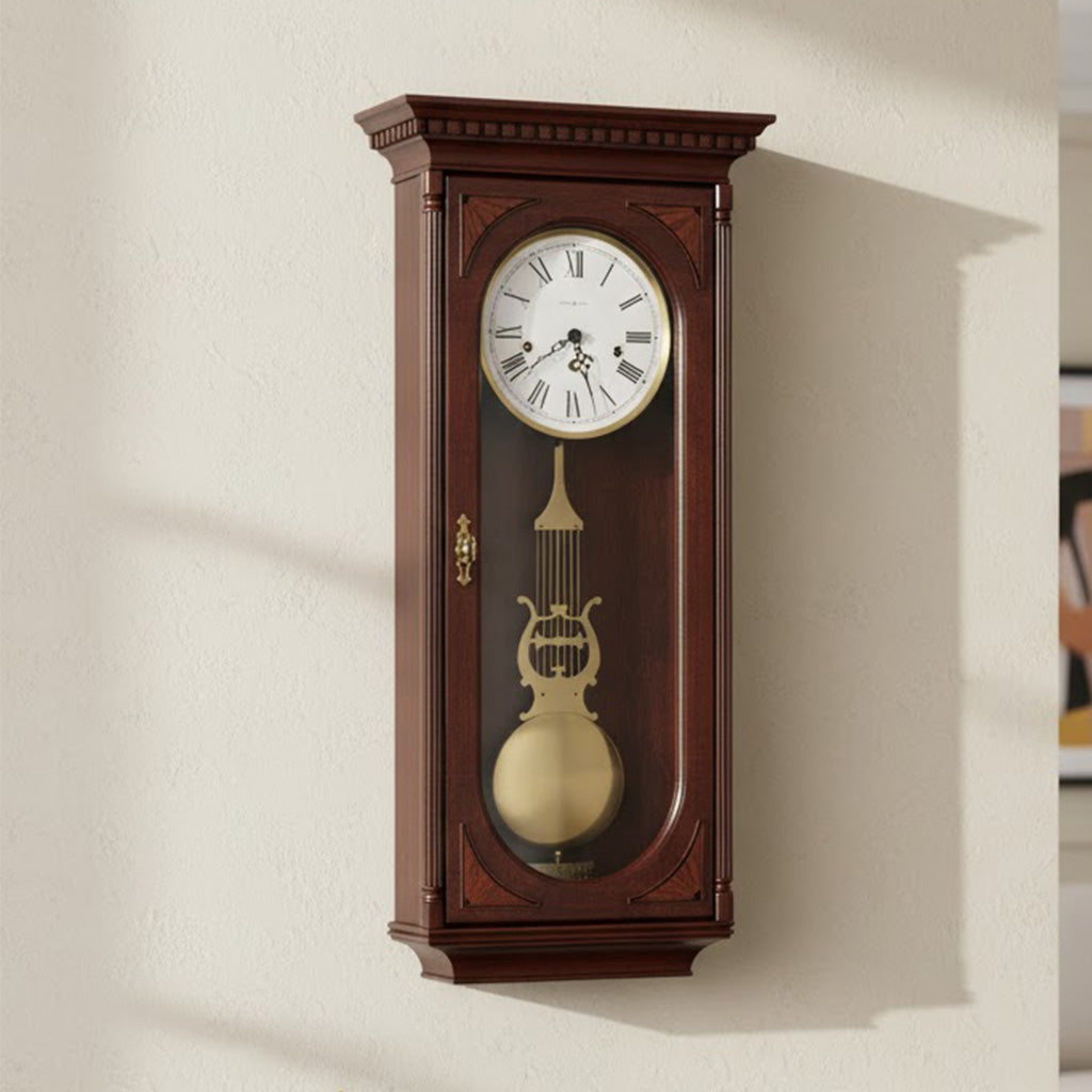 Elegant wooden wall clock in mahogany finish, featuring a pendulum and Roman numerals.