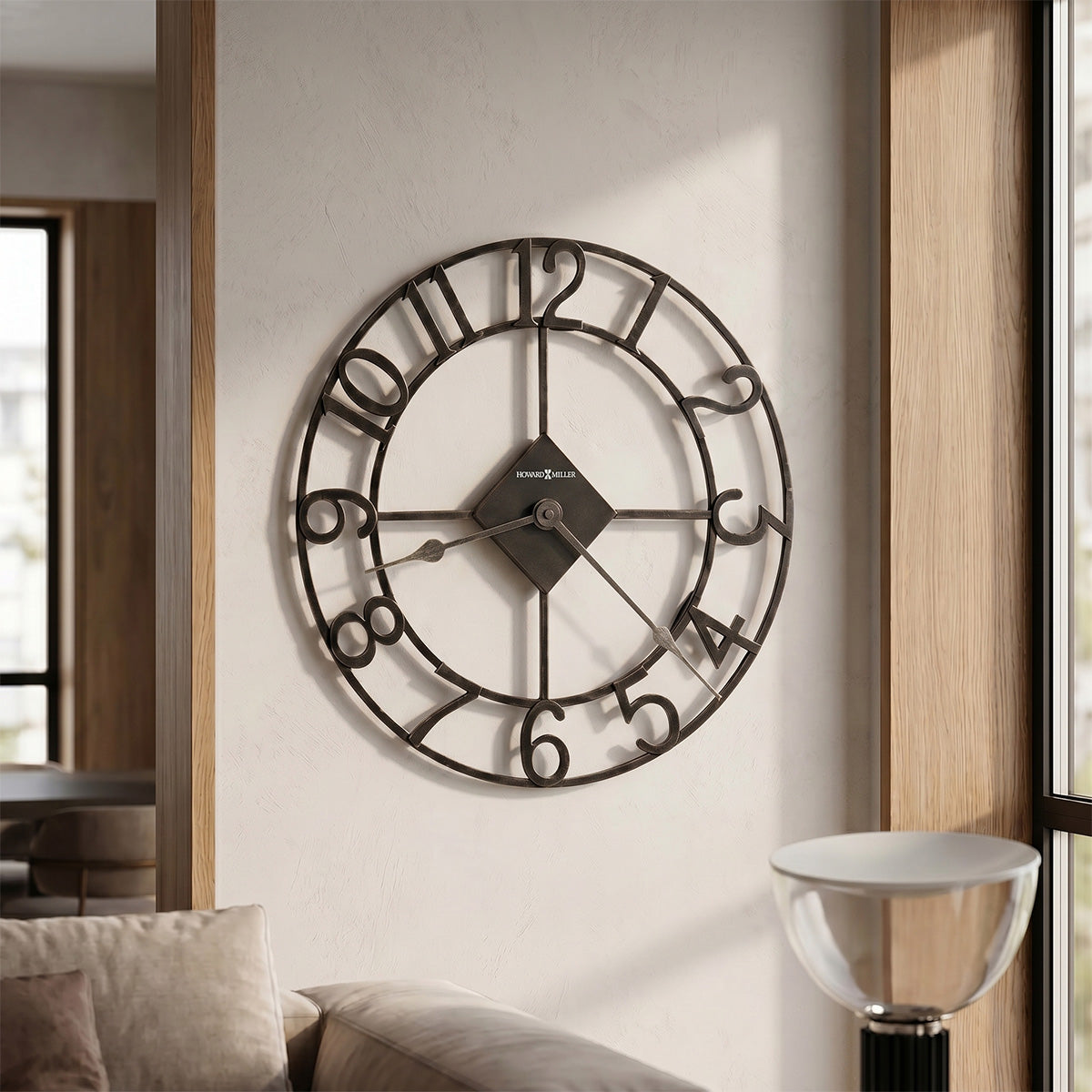 decorative wall clock on a white wall in a living room setting.