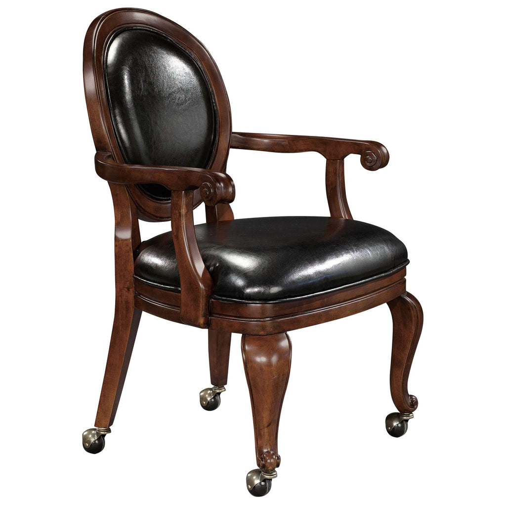 Antique wooden chair with a black leather seat and rolling casters.