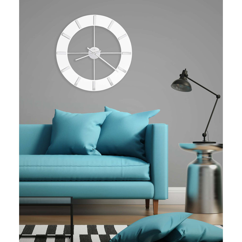 Modern living room with a turquoise sofa, decorative pillows, a clock on the wall, and a floor lamp.