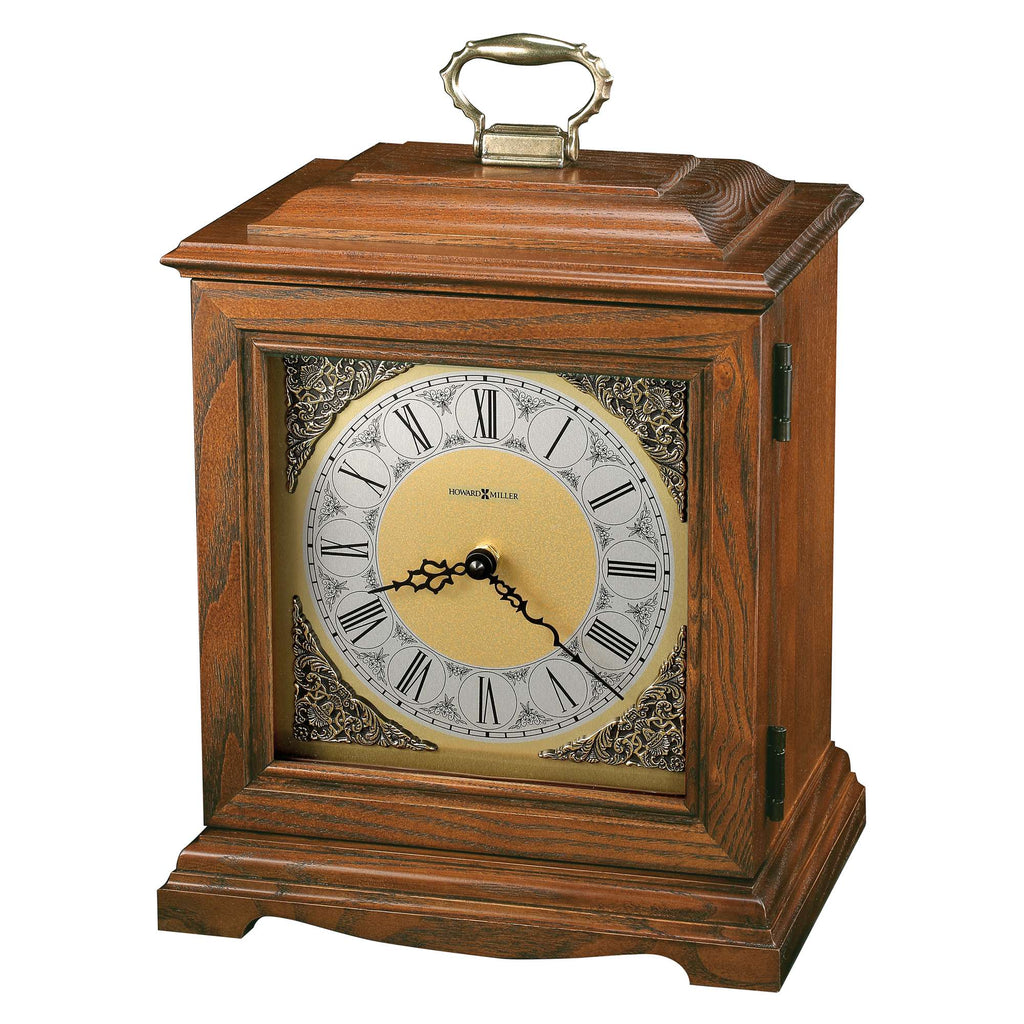 A vintage wooden mantel clock with a Roman numeral face and decorative detailing.