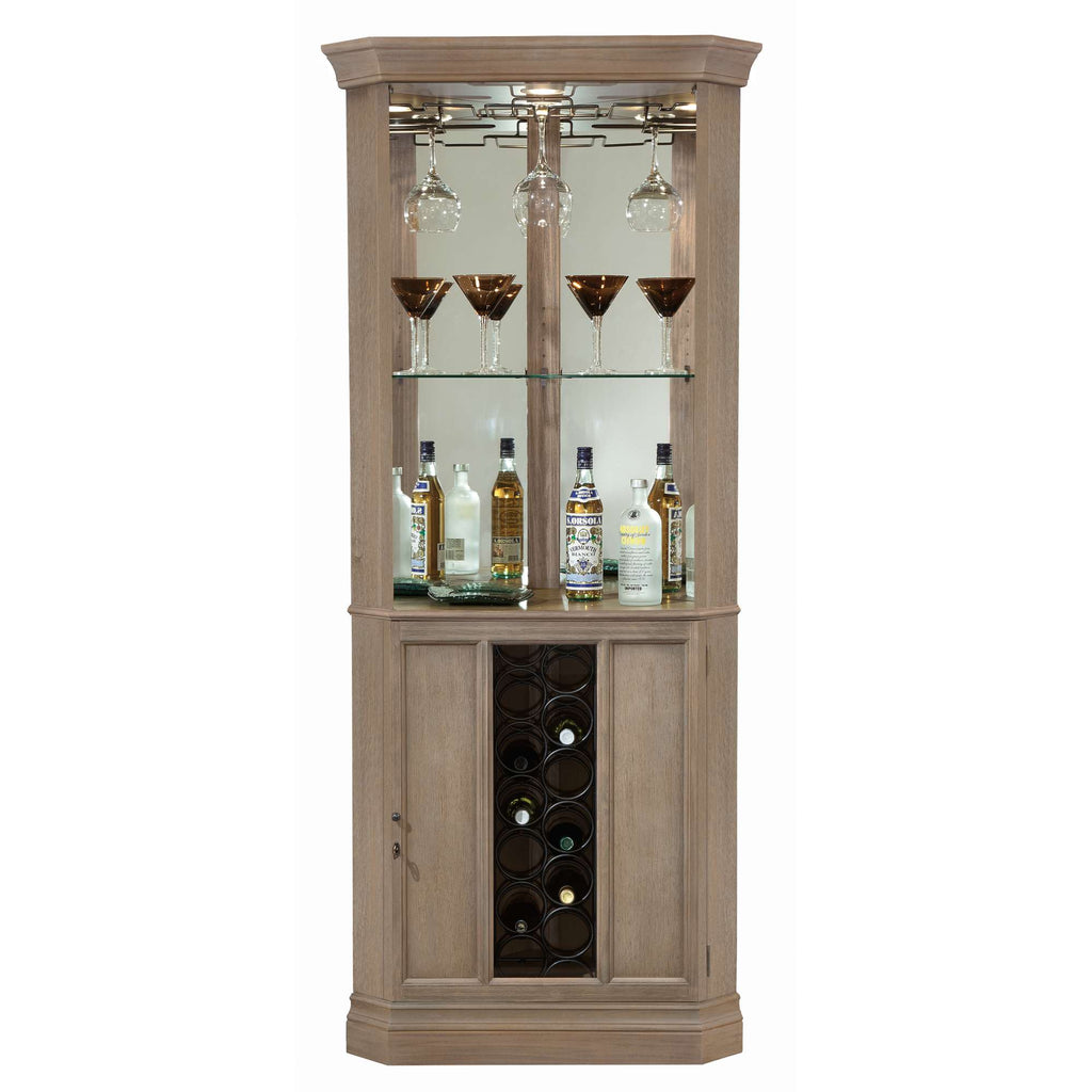 Wooden curved cabinet with glass shelves displaying liquor bottles and wine storage