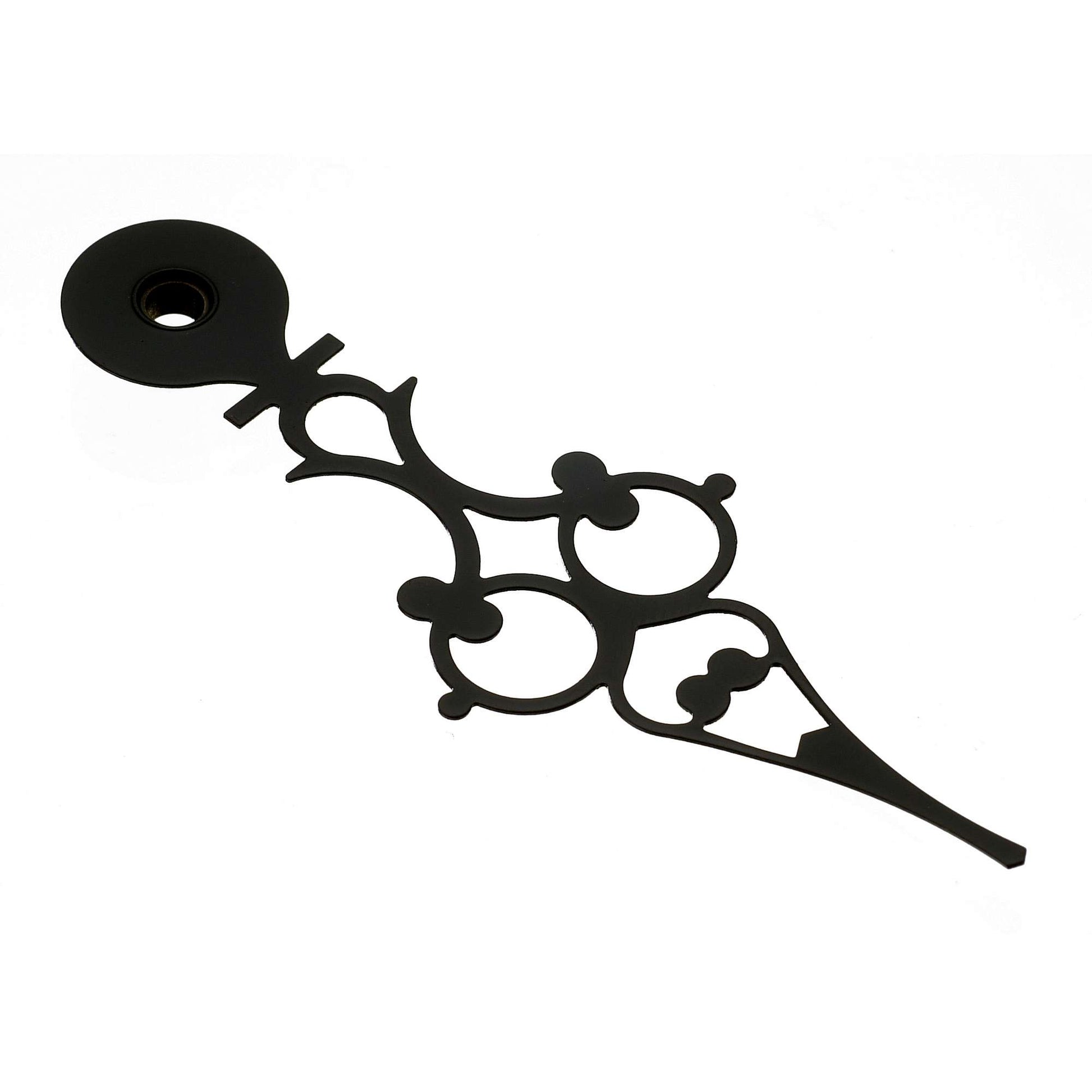 An ornate black clock hand with intricate shapes and designs.