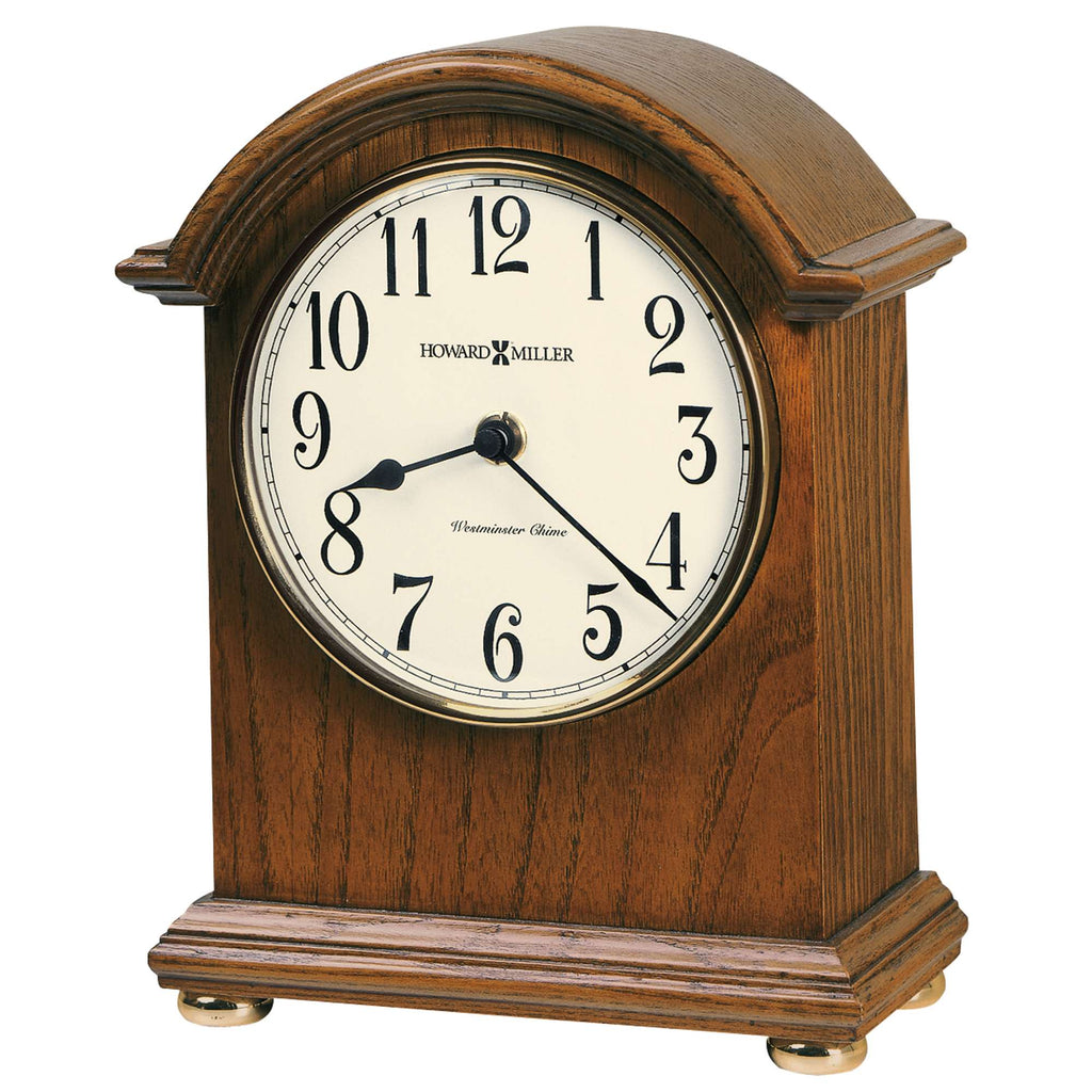 Wooden mantel clock with white face and black numbers