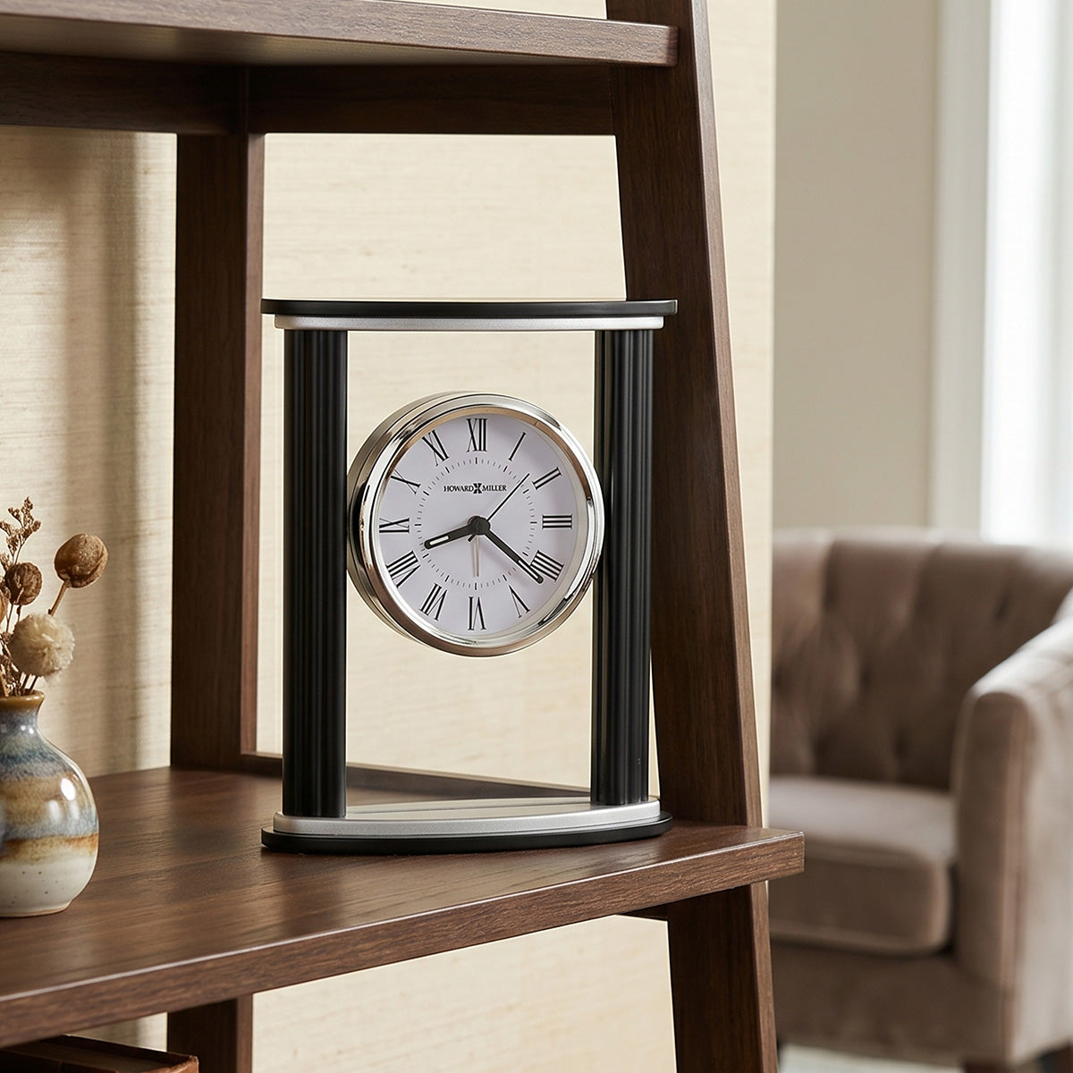Decorative clock on a wooden shelf with a blurred background