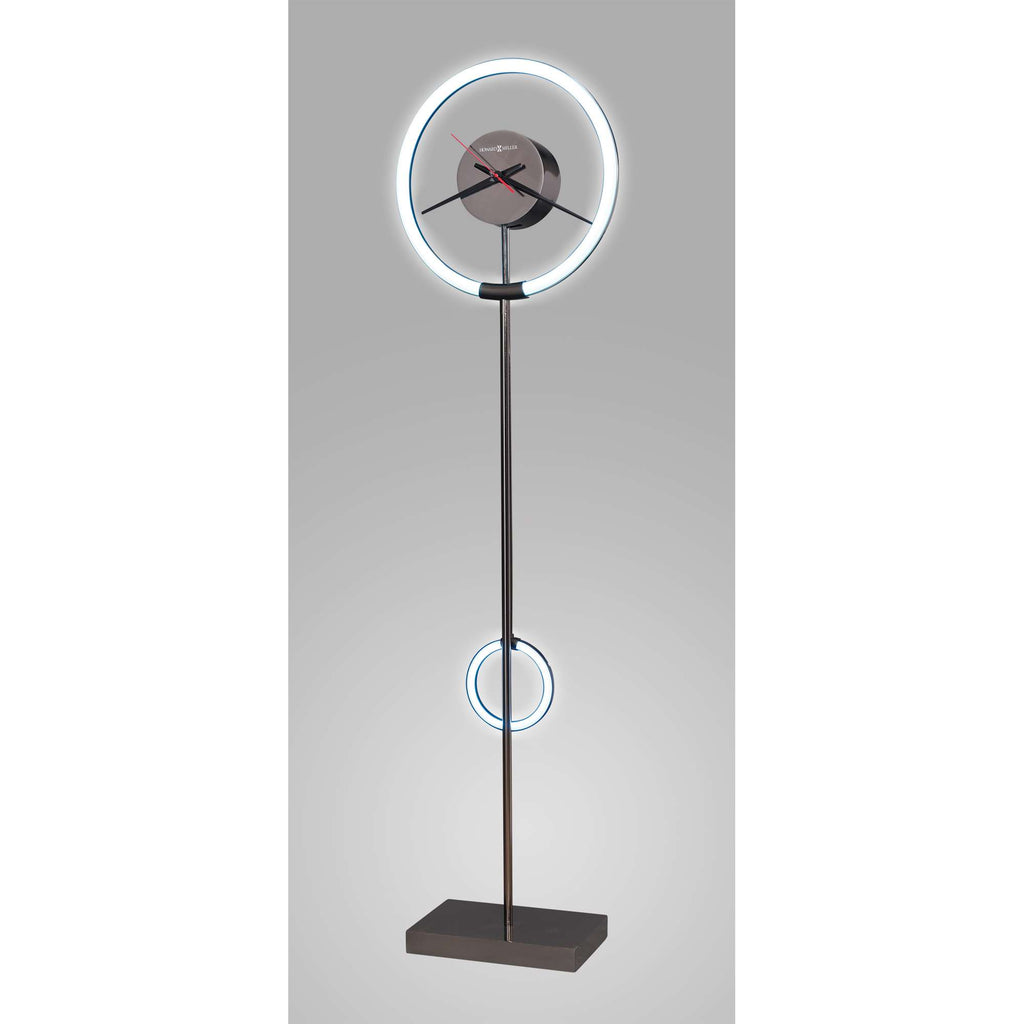 Modern floor clock with a circular design and LED accents.