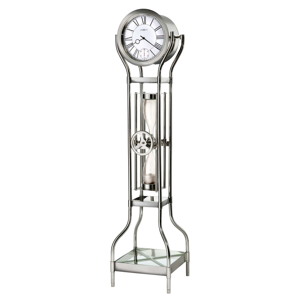 A modern floor clock with a round dial and an hourglass design.