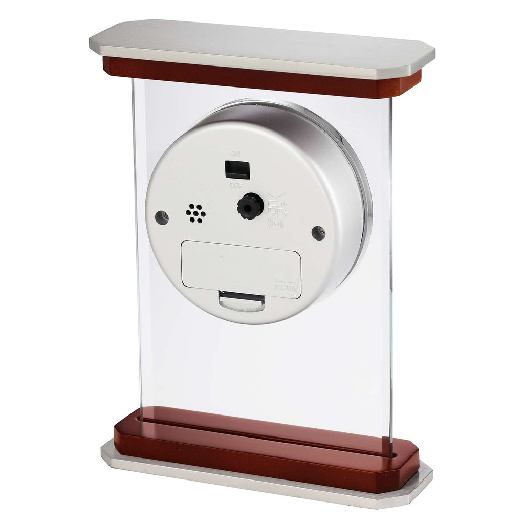 A modern device mounted on a clear stand, featuring a circular base with ports and buttons.