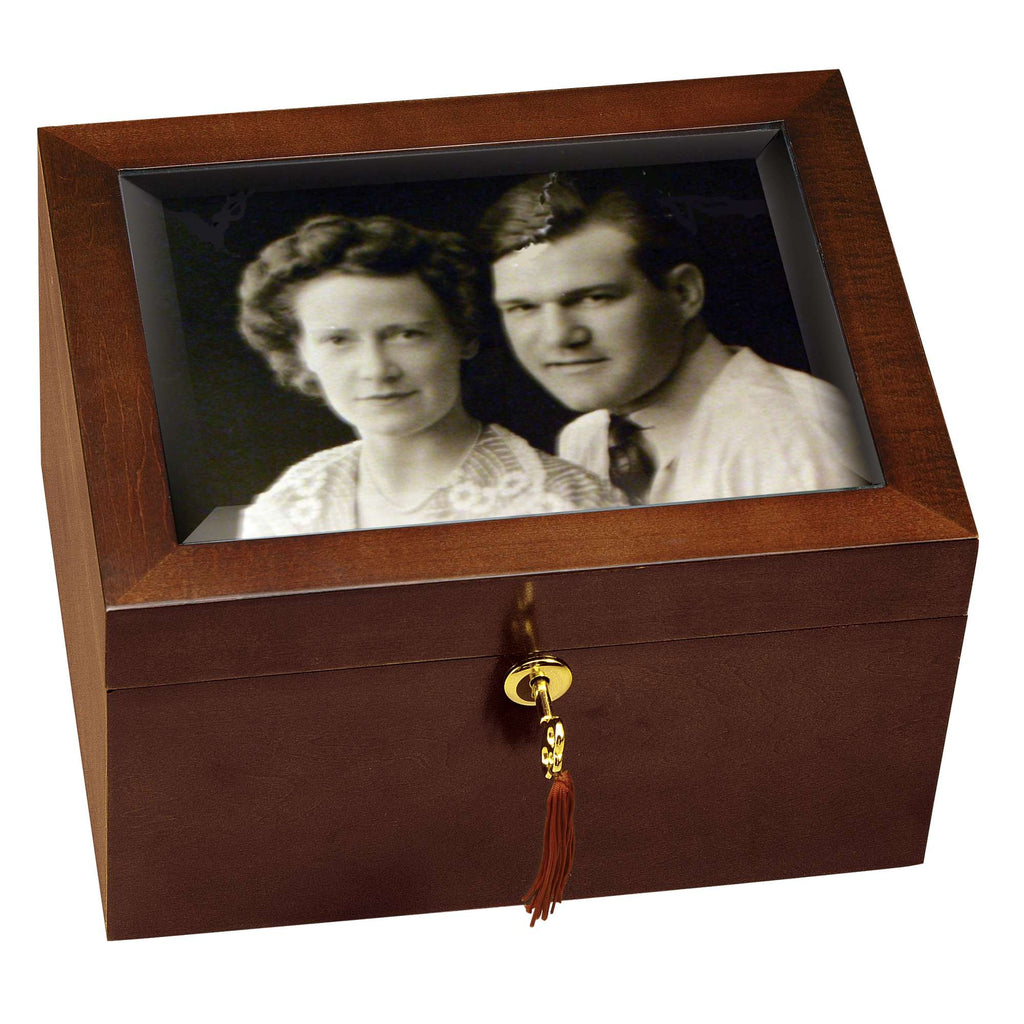 A wooden box with a vintage black and white photograph of a couple displayed on the lid.