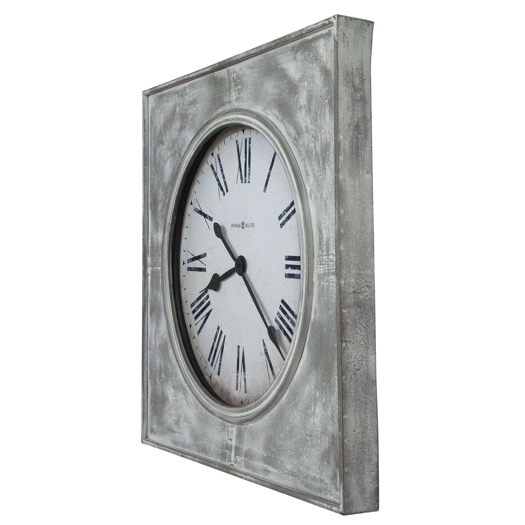 A vintage-style wall clock with Roman numerals and a distressed silver frame.