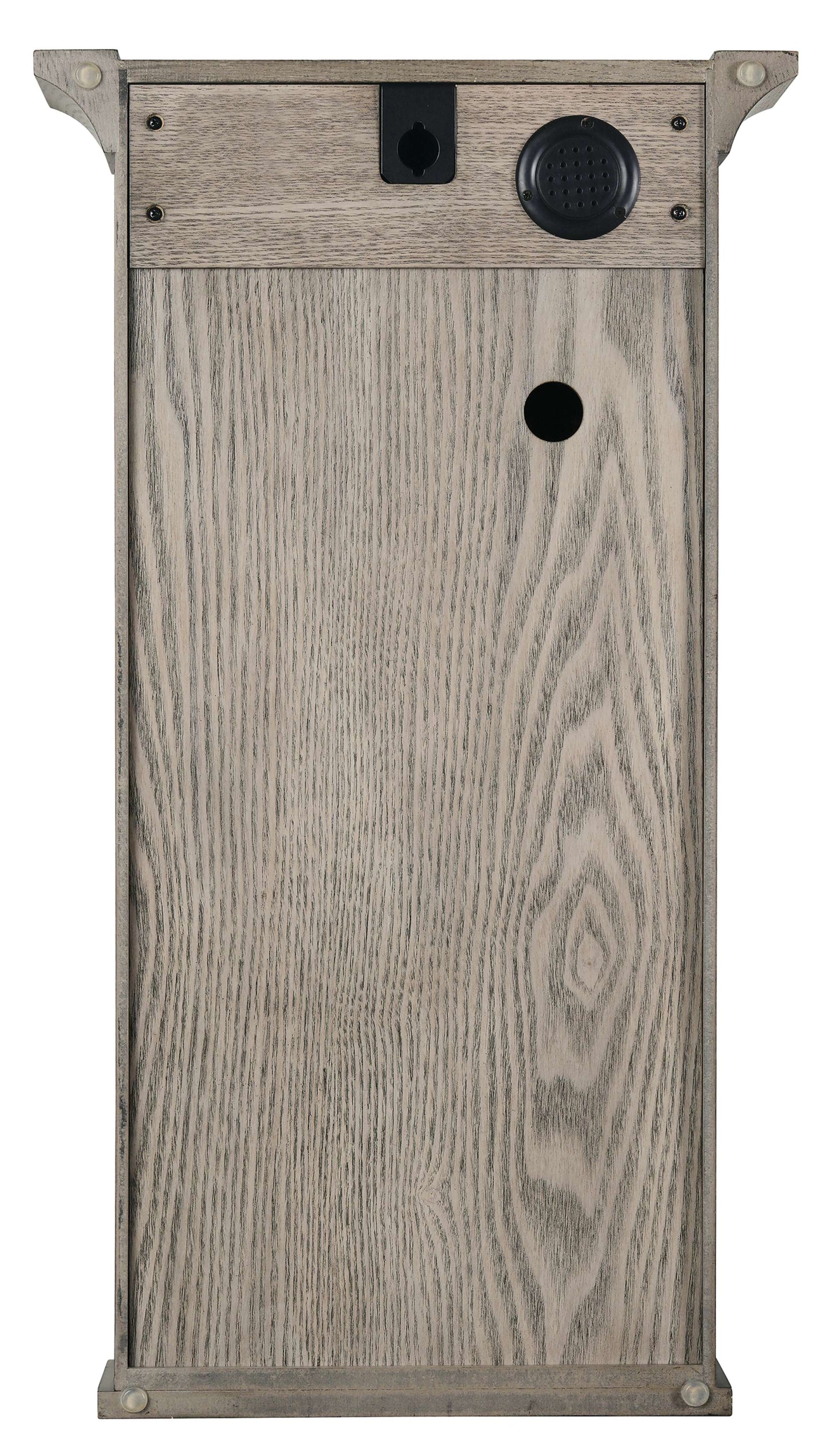 Front view of a wooden box with various holes and openings