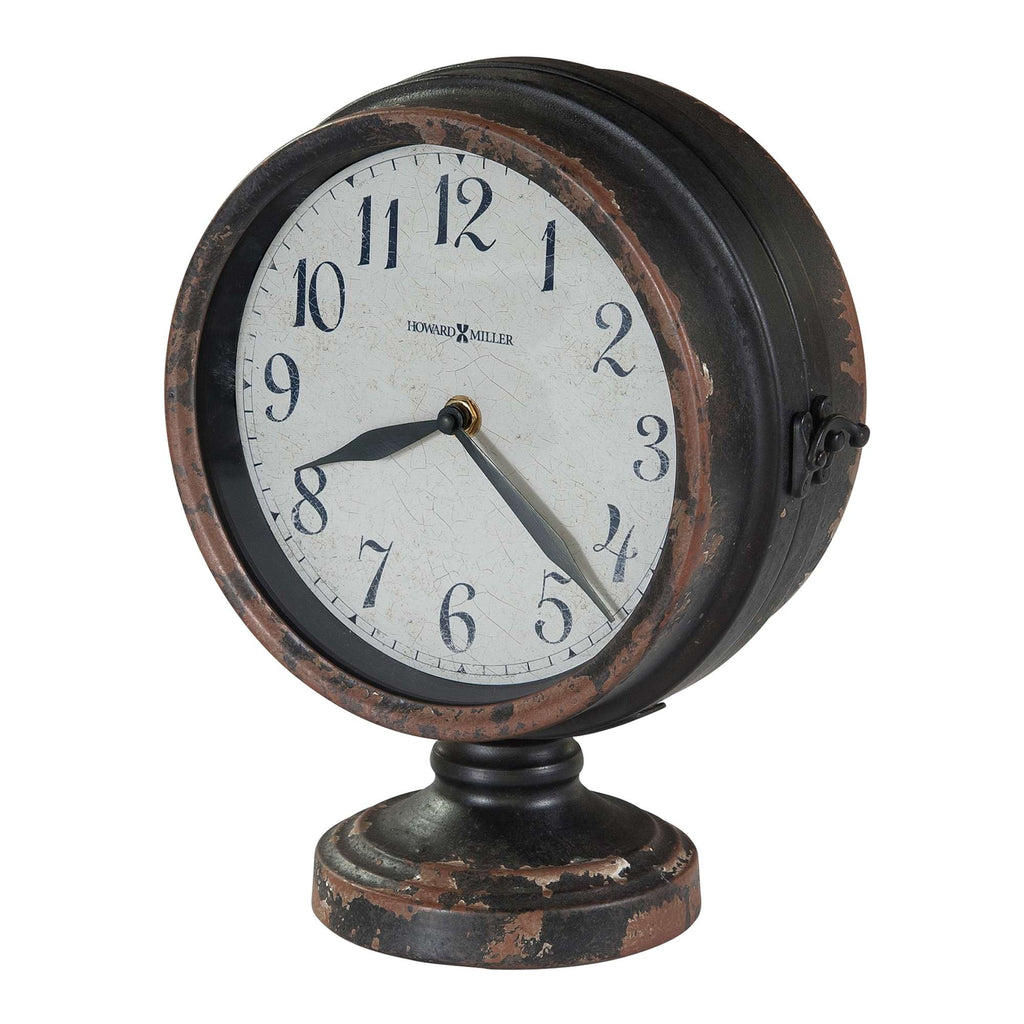 Vintage round alarm clock with a weathered finish