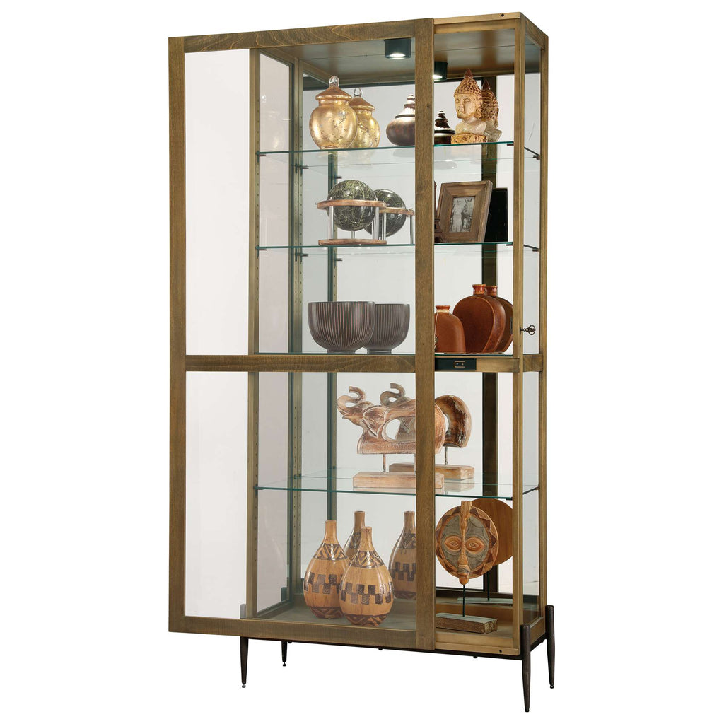 Glass display cabinet showcasing various decorative items and pottery.